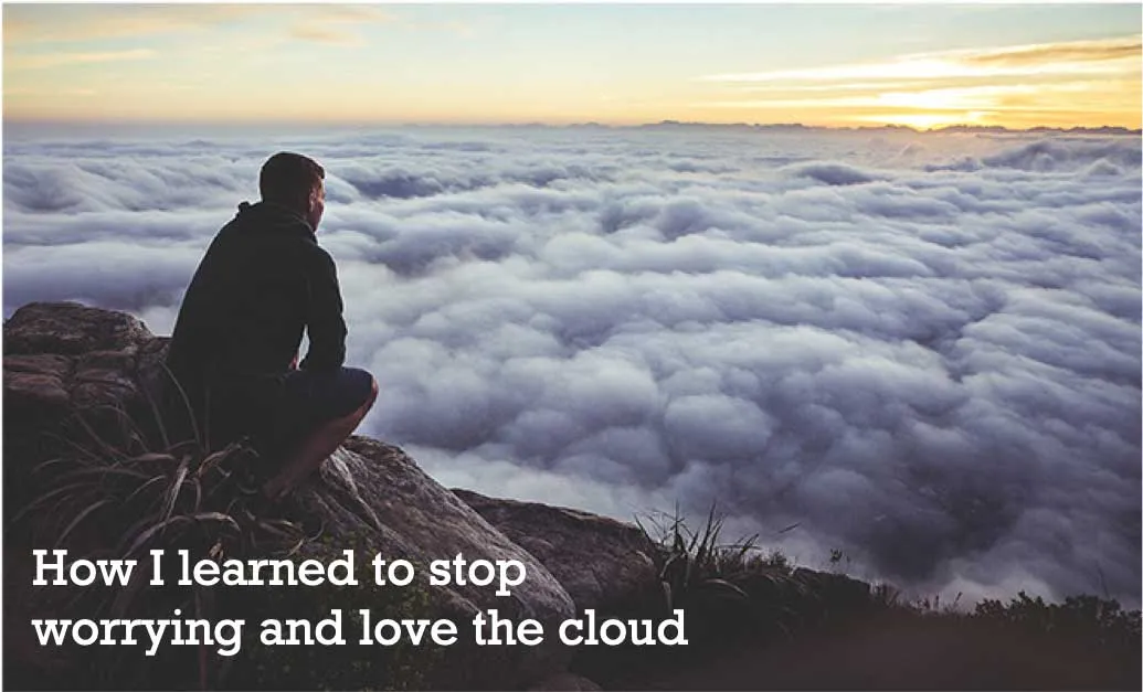 man looking out over clouds